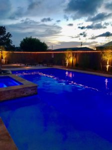 gorgeous pool and lighting at night - pool has a light show setting